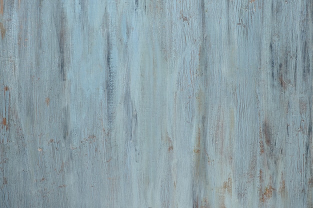 Light grey-bluish wooden texture with crackled paint. Aged grunge background