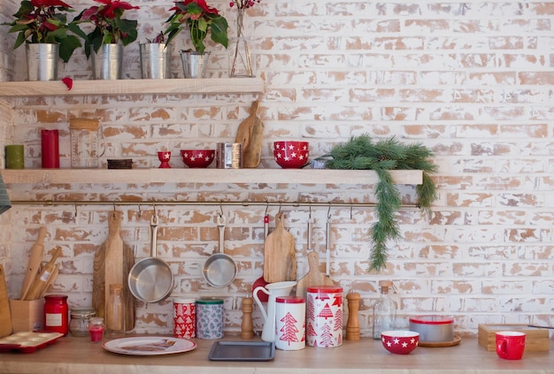 Photo light kitchen with brick walls and red christmas decorations and lights