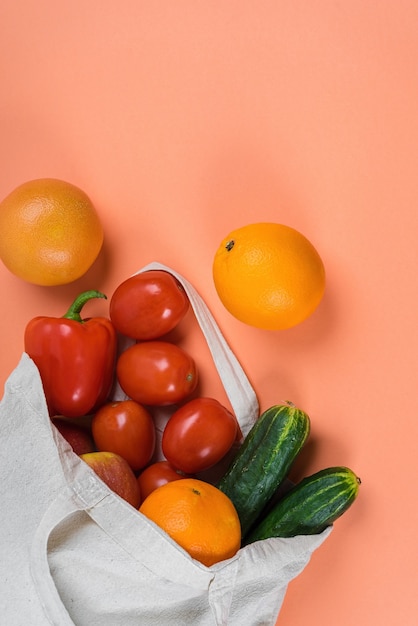 Light linen eco bag with fresh vegetables and fruits