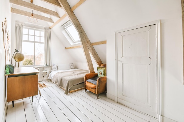 Light mansard bedroom with window