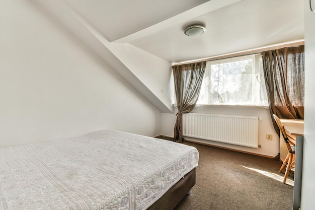 Light mansard bedroom with window