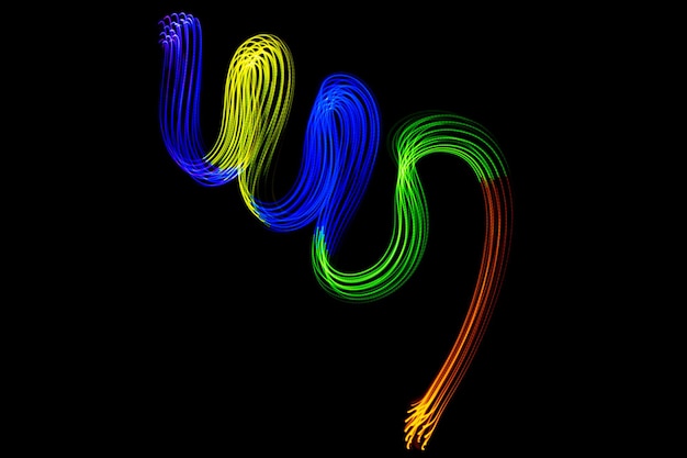 Light neon trails colorful wave isolated on black background.\
futuristic colorful overlay light pattern.