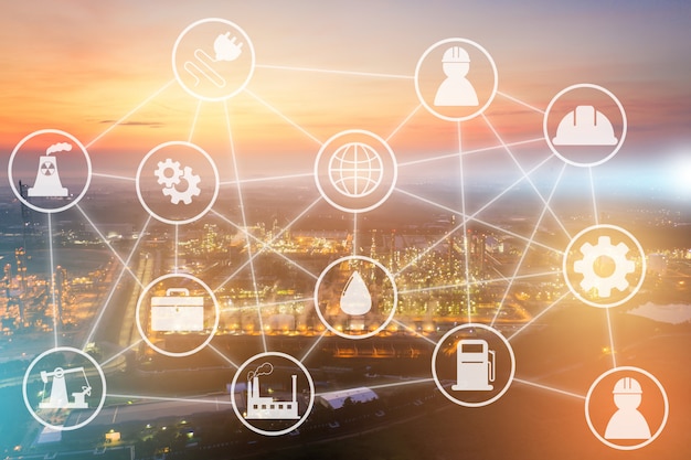 Light oil refinery at twilight with system icons diagram on industrial factory