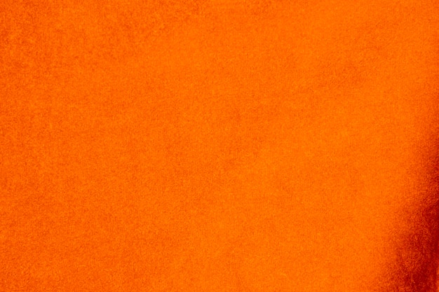 Photo light orange velvet fabric texture used as background silk color saffron fabric background of soft and smooth textile material crushed velvet luxury sun light tone for silk