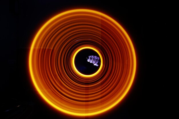 Light painting against sky at night