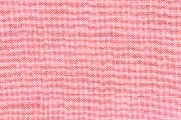 Light pink background from a textile material with wicker pattern