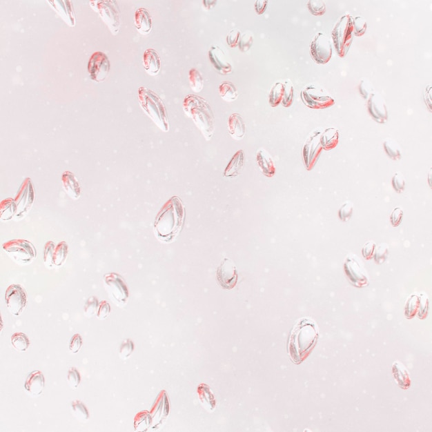 Light pink droplets on a window background