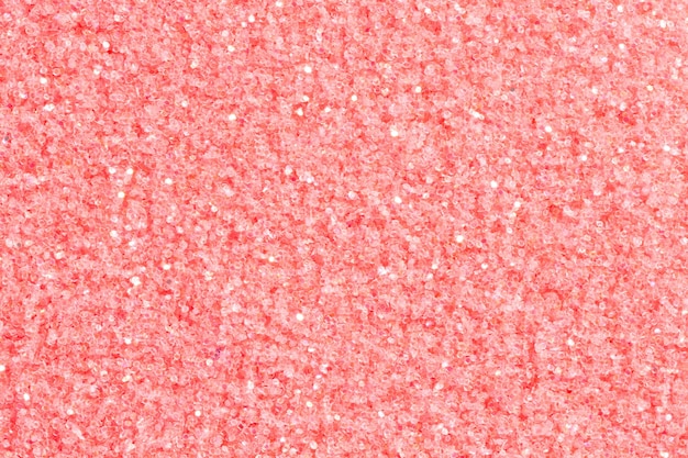 Light pink glitter background with glare Pink glitter texture