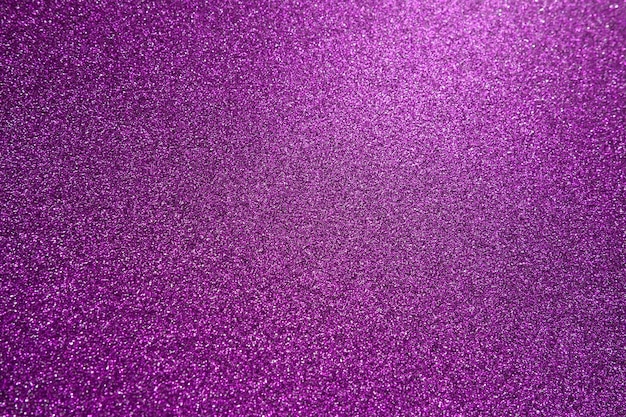 Foto luce su una superficie viola viola rosa bokeh bagliore festivo sfondo luminoso nuovo anno natale