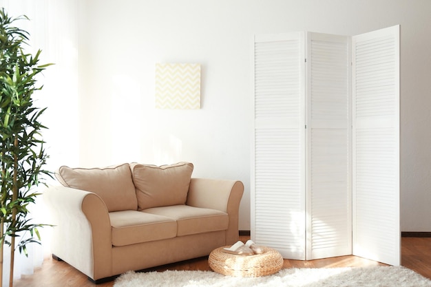 Light room interior with folding screen