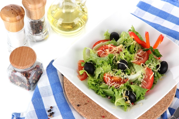 Light salad on plate on napkin