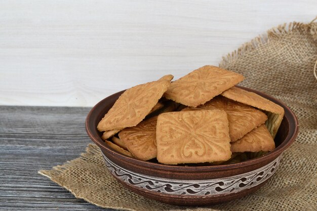 light shortbread cookies in a plate on burlap