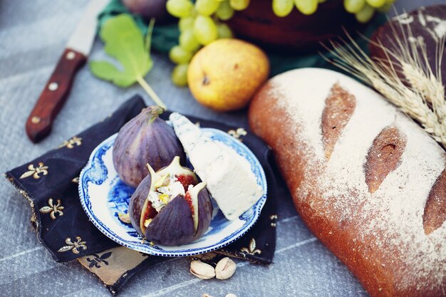 Light snacks of cheese, figs, grapes, nuts