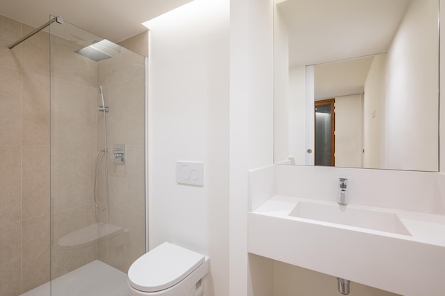 Light spacious bathroom in a minimalist design with everything you need washbasin built into a