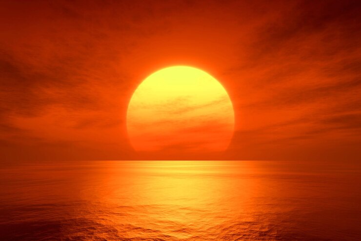 Photo light sunset orange sun calm orange sea with sun through nature horizon over the water with a cloudy sky