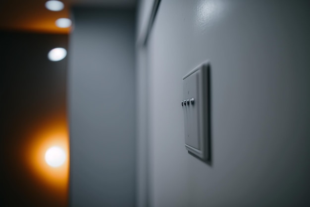 A light switch on a wall with the word light on it