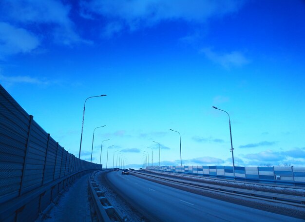 Light traffic on bridge road transport background