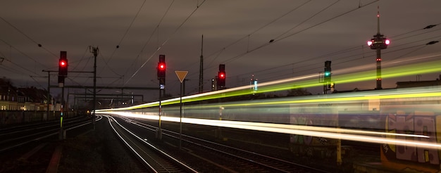 Photo light trail on railroad track at night