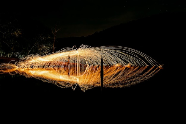 Photo light trails against sky at night