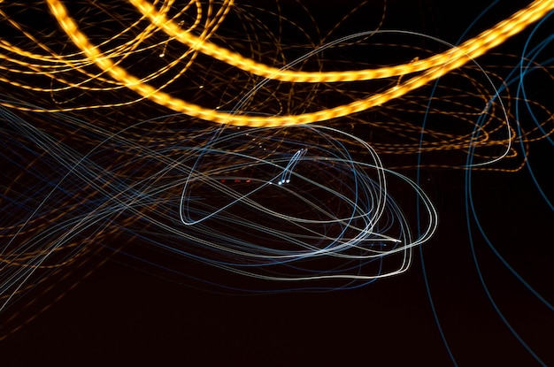 Photo light trails over black background