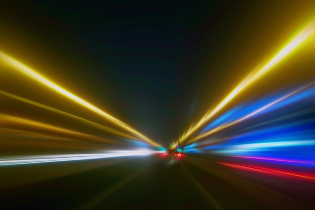 Light trails in the dark, traffic light trails, abstract\
traffic lines background