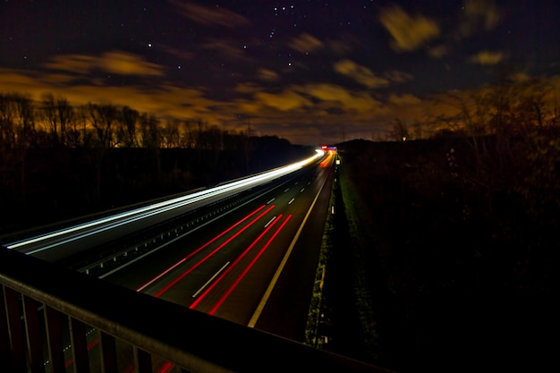 Photo light trails on highway at night