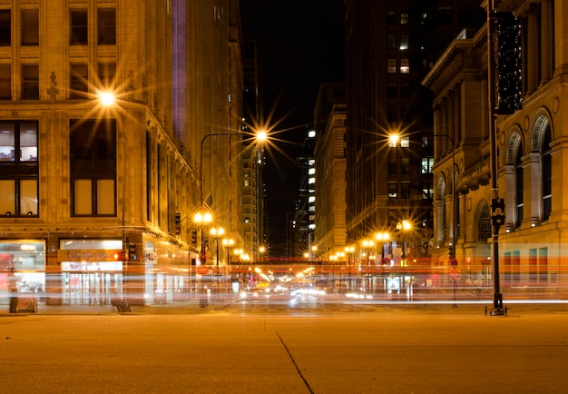 Light trails in illuminated city at night