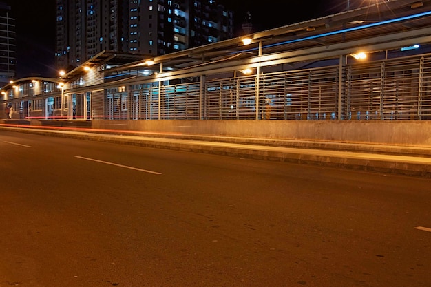 Light trails on road in city at night