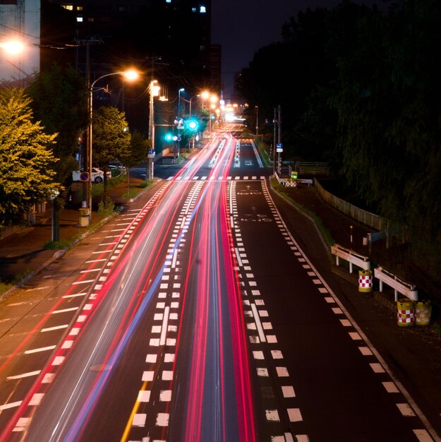 Light trails on road in city at night