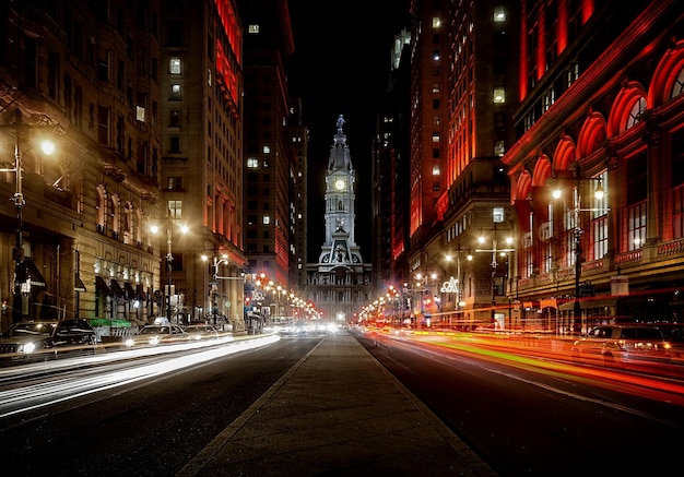 light trails on road leading towards philadelphia city hall at night