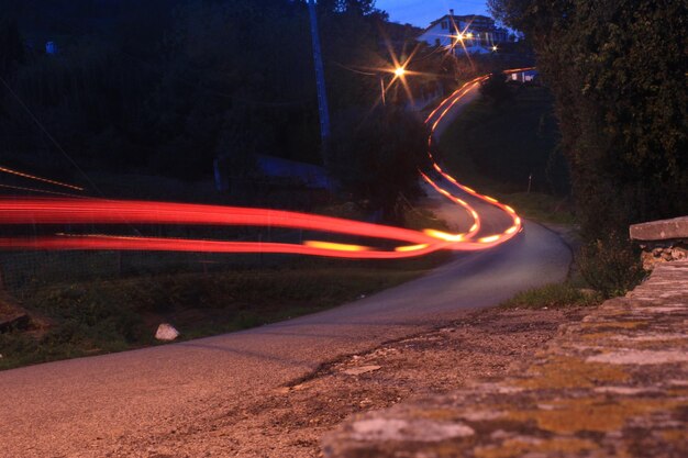 Photo light trails on road at night