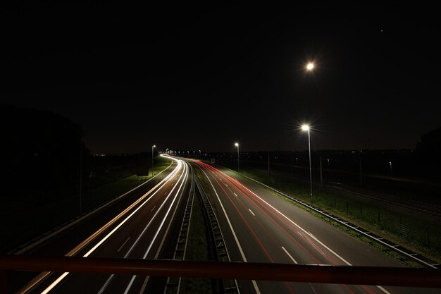 Photo light trails on road at night