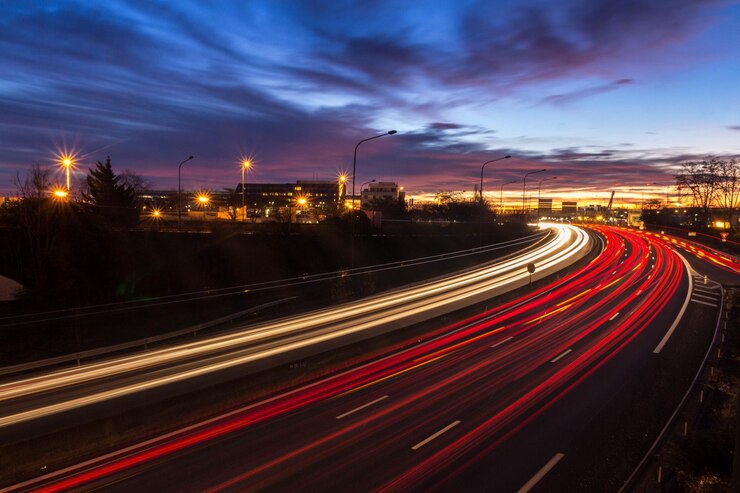 Photo light trails on road at night