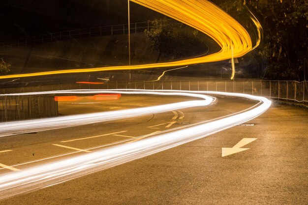 Photo light trails on road at night