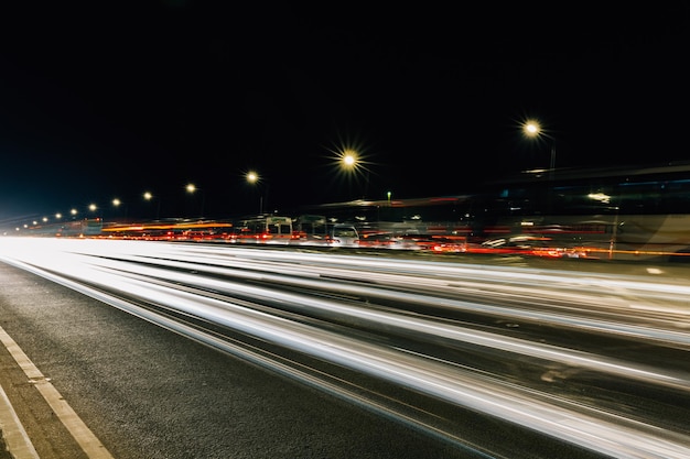 Photo light trails on road at night