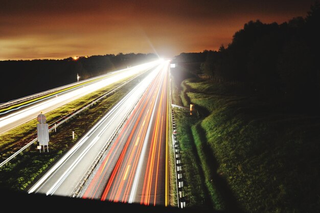 Photo light trails on road at night