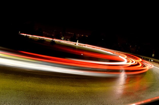 Photo light trails on road at night