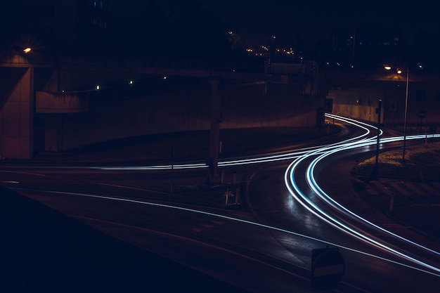 Photo light trails on road at night