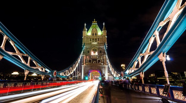 Photo light trails on suspension bridge at night