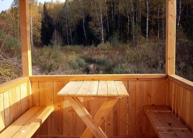 Light wooden gazebo in the woods