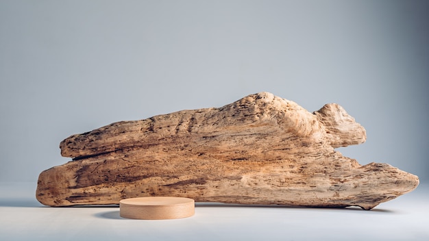 Light wooden podium on a background of old wood