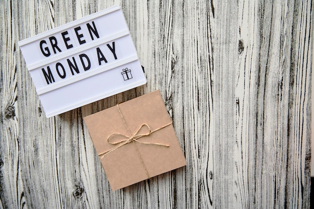 Lightbox with Green Monday text craft gift box Concept of online shopping Top view Copy space