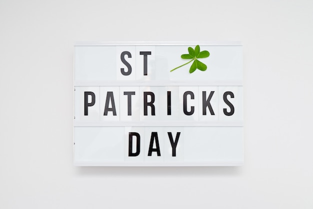 Lightbox with text St Patricks Day and leaf of clover on white