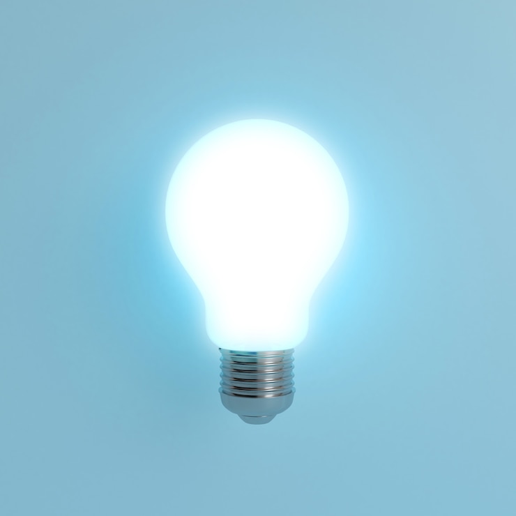 Photo lightbulb on blue pastel background
