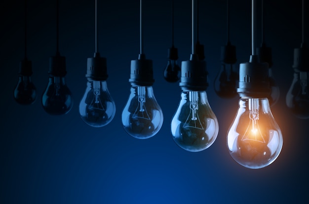 Lightbulbs on blue background, idea concept