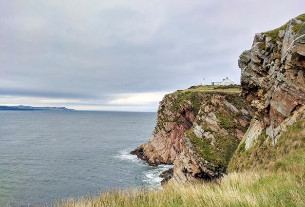 Lighthouse on the cliffs in northern ireland