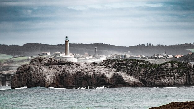 A lighthouse is in the distance