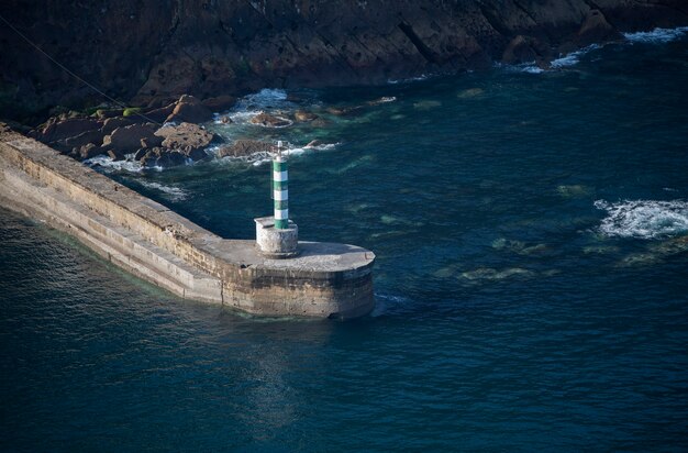 Lighthouse marking the entrance to a harbor