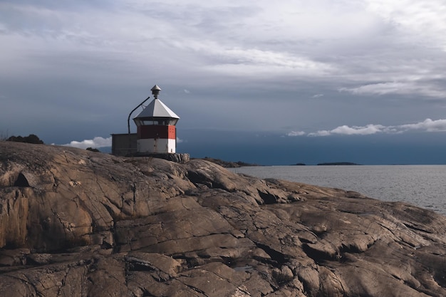 lighthouse on a rocky beach