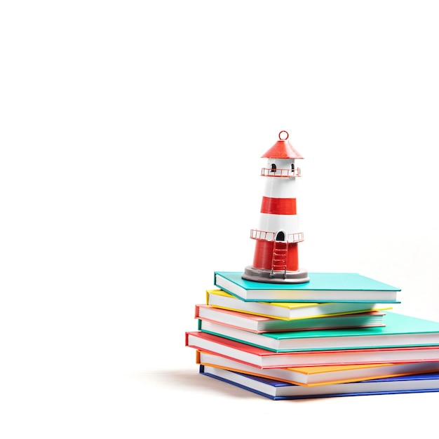 Lighthouse standing on the pile of books International literacy day
